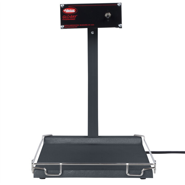 A black rectangular Hatco portable food warmer with a black label on a counter.