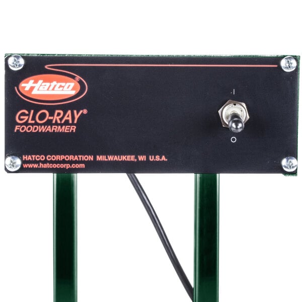 A green Hatco Glo-Ray portable french fry warmer on a table.