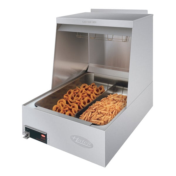 A stainless steel portable fry holding station with two compartments containing onion rings and fries.