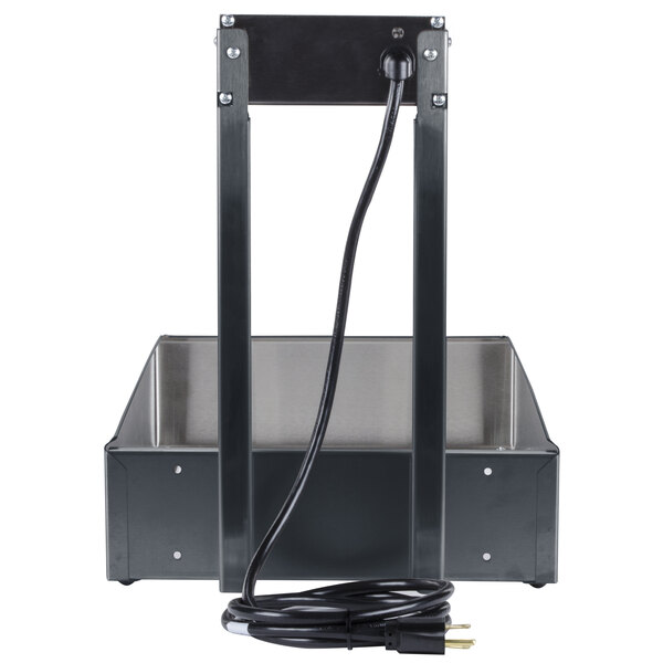 A black metal frame with a black and silver metal box and a black cord inside.