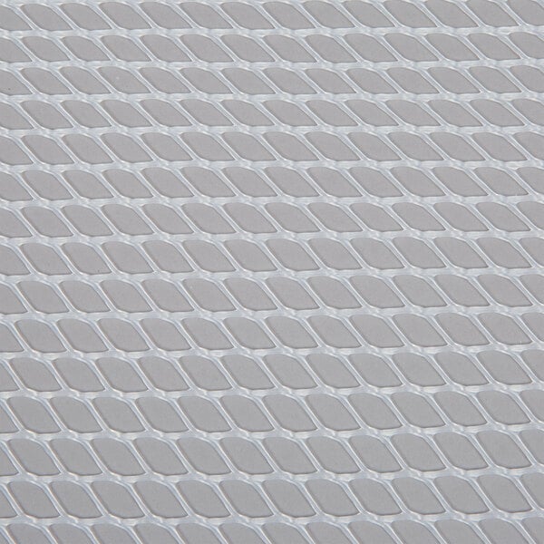 A close up of a clear grid shelf liner.