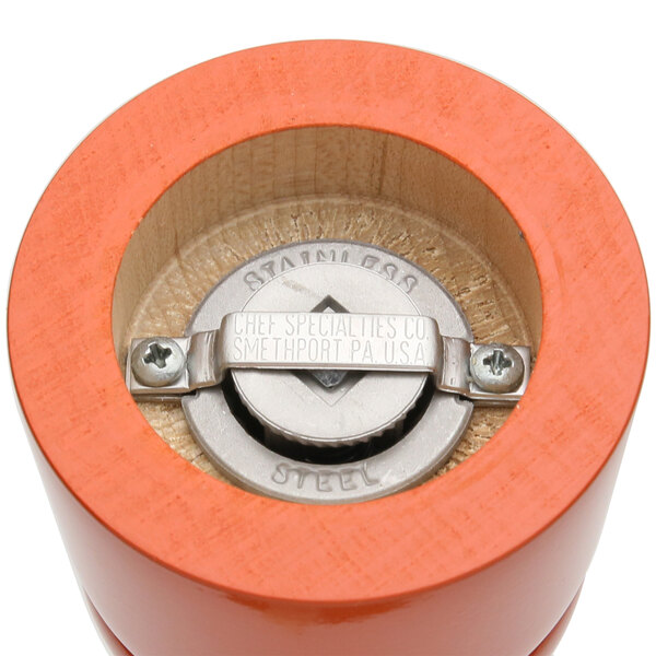 A close-up of the Chef Specialties Butternut Orange Pepper Mill with a metal grinder.