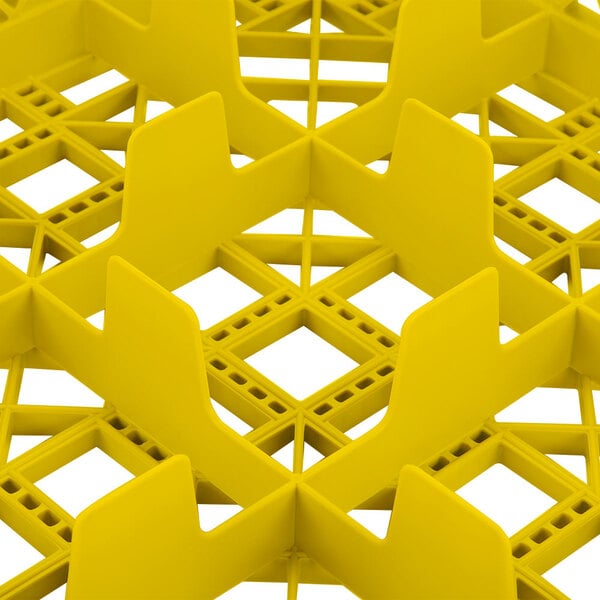 A Vollrath yellow plastic glass rack with 9 compartments.