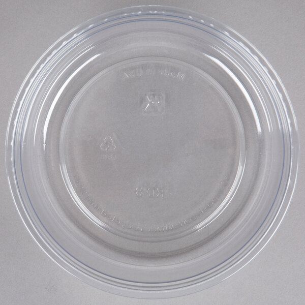 A Fabri-Kal clear plastic deli container with a blue rim.
