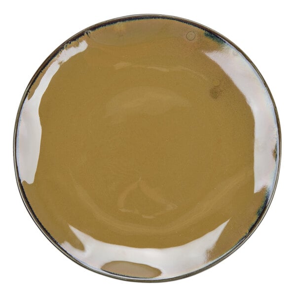 A Tuxton Artisan Mojave china plate with a brown background and black rim.