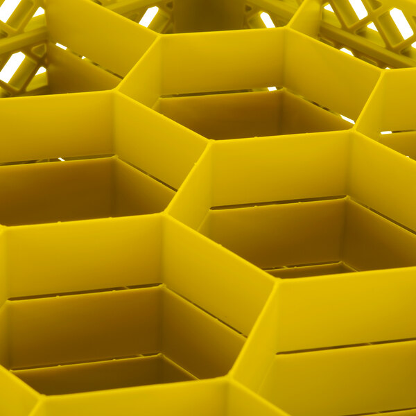 A yellow Vollrath Traex glass rack with an open rack extender on top.