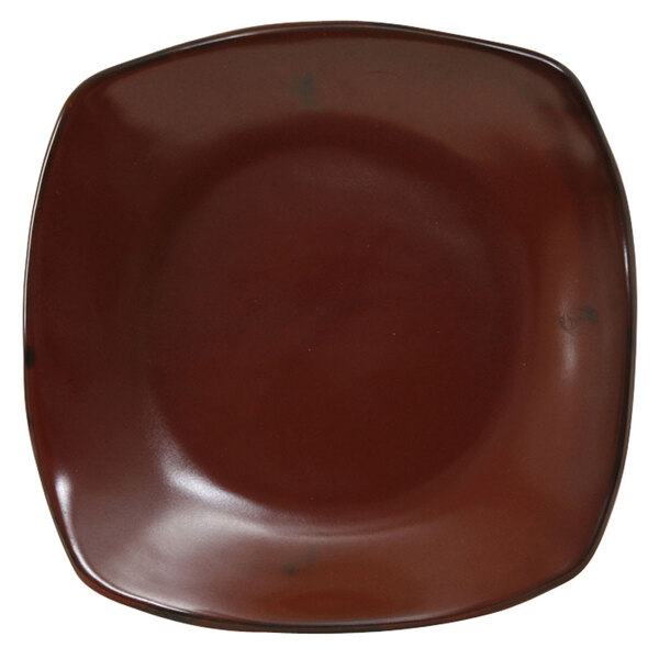 A brown square Tuxton Artisan China pasta plate with a white background.