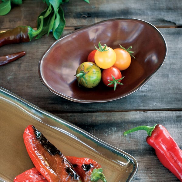 A Tuxton TuxTrendz Capistrano bowl of tomatoes and peppers on a counter.