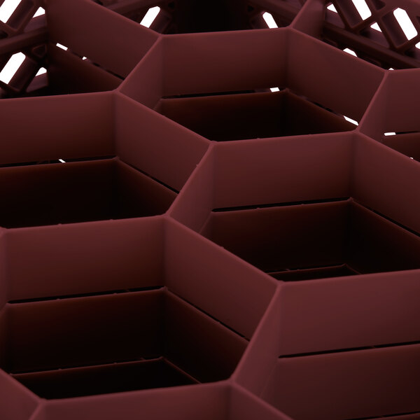 A Vollrath Traex burgundy 12-compartment glass rack with an open rack extender on top.