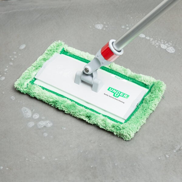 An Unger aluminum pad holder attached to a green mop.