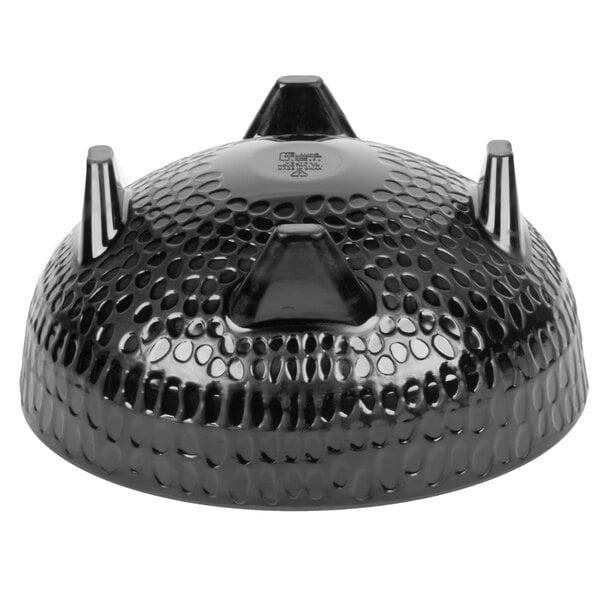 A black melamine bowl with four pointy spikes on top.