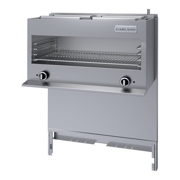 A stainless steel liquid propane range-mount infra-red cheese melter with control knobs and a wire rack, designed for use with G36 Series ranges.
