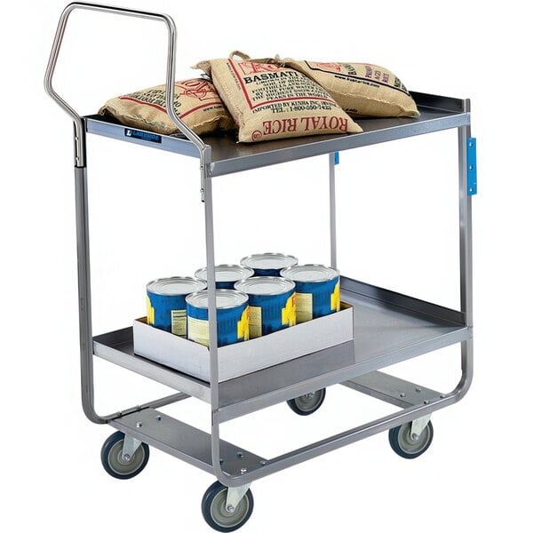 A Lakeside stainless steel utility cart with bags and cans of food on it.