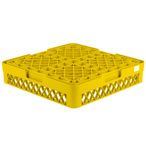 A yellow plastic Vollrath Traex rack with 12 compartments for glasses.