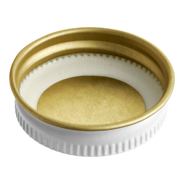 A white and gold Libbey growler cap with a gold rim.