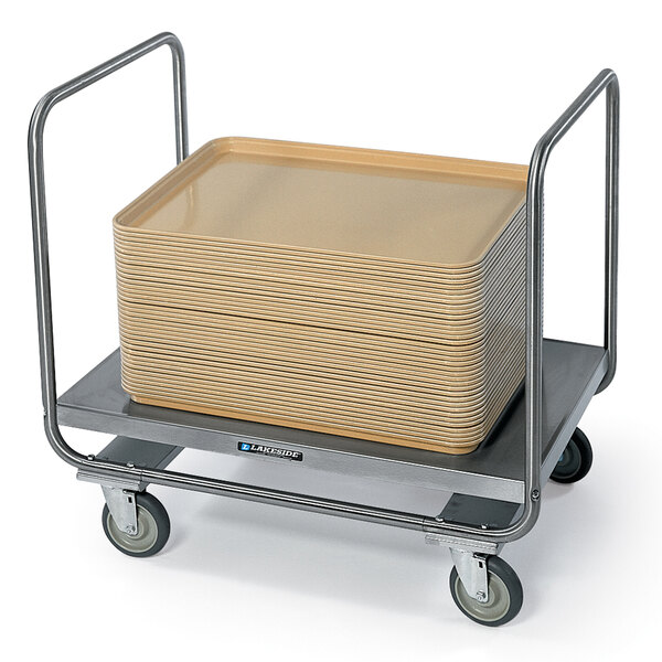 A Lakeside stainless steel platform truck with square brown trays stacked on it.