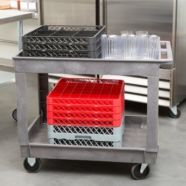 A Lakeside plastic utility cart with plastic containers and glasses on it.