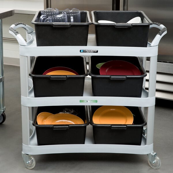 A Lakeside light gray plastic utility cart with black containers and a yellow plate on it.