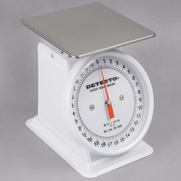 A Cardinal Detecto PT-2 mechanical portion scale with a silver top and metal base.