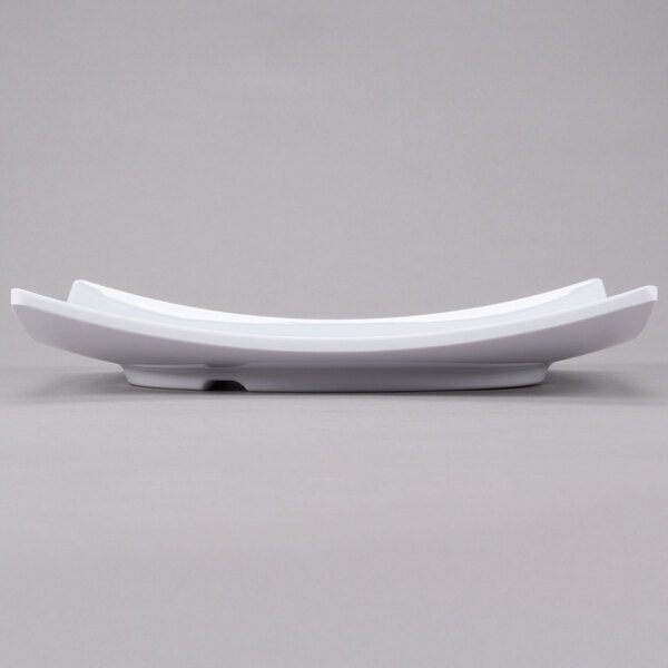 A white square Thunder Group melamine plate with curved edges.