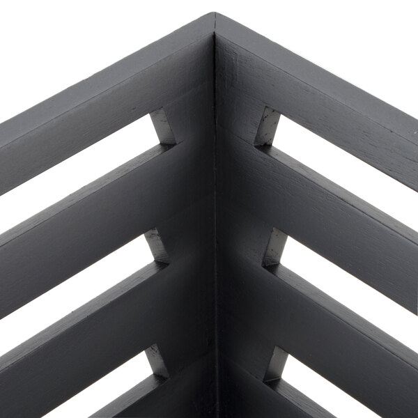 A close up of an American Metalcraft square birch bread basket.