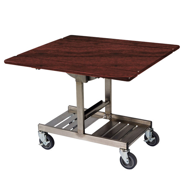 A Geneva tri-fold room service table with red maple finish on a metal cart with wheels.