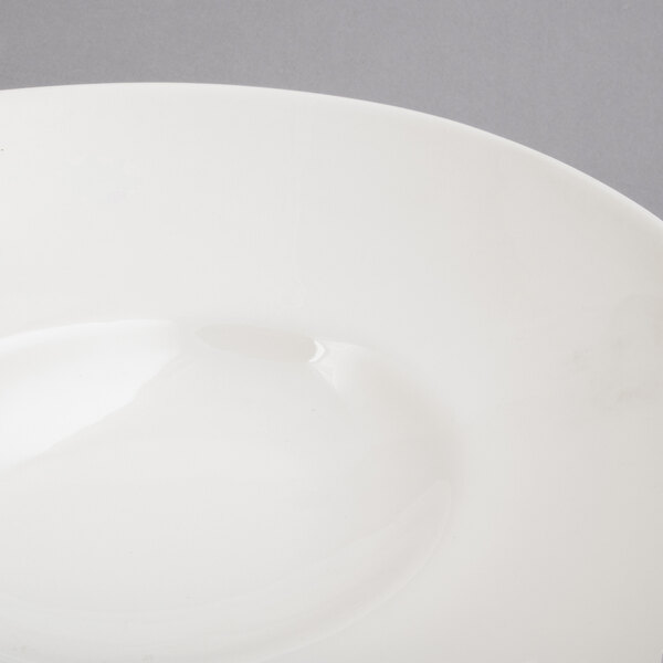 A close-up of a 10 Strawberry Street Whittier white shallow oval bowl.