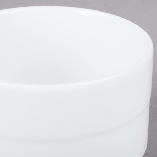 An Arcoroc white bouillon cup.