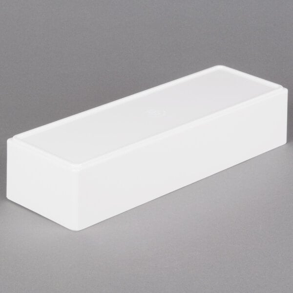 A white rectangular Cal-Mil melamine box on a gray surface.
