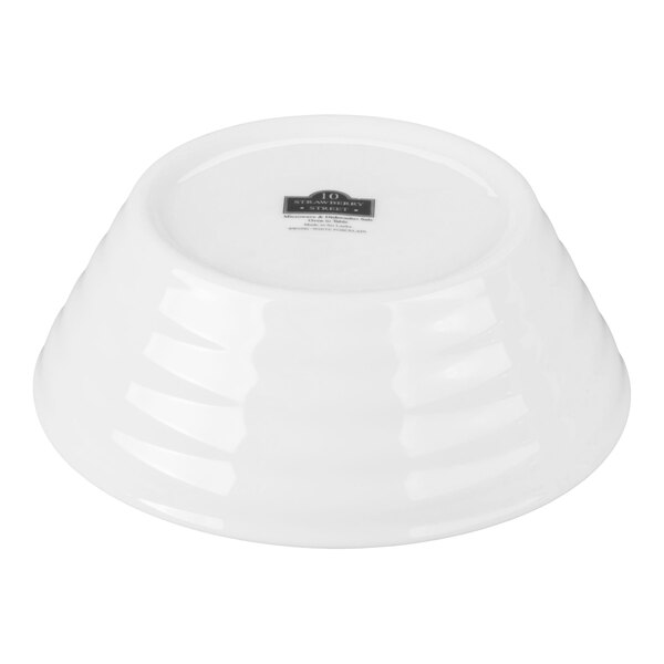 A white porcelain cereal bowl turned upside down.