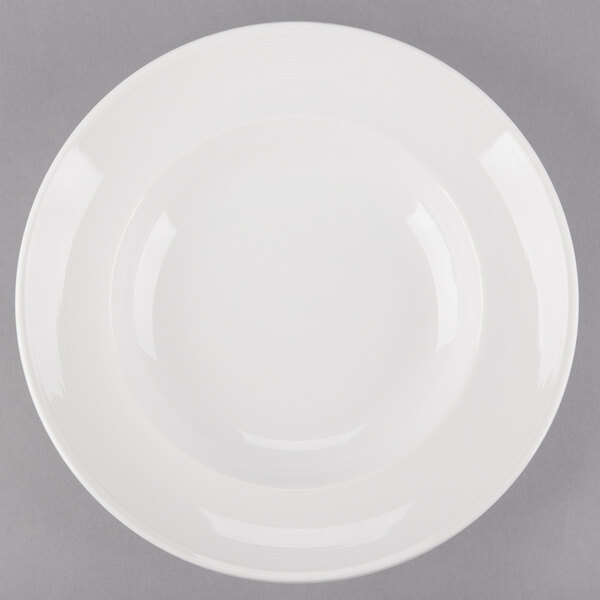 An Arcoroc Rondo white bowl with a white rim.