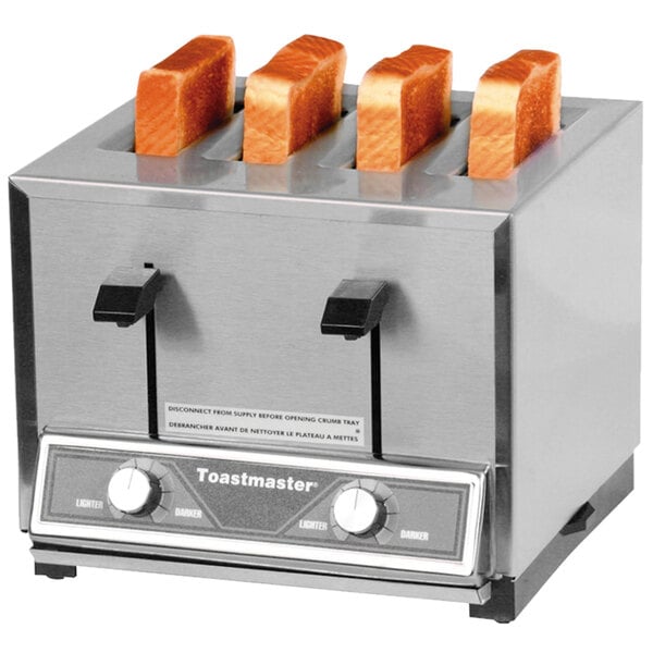 A Toastmaster commercial toaster with four slices of bread in it.