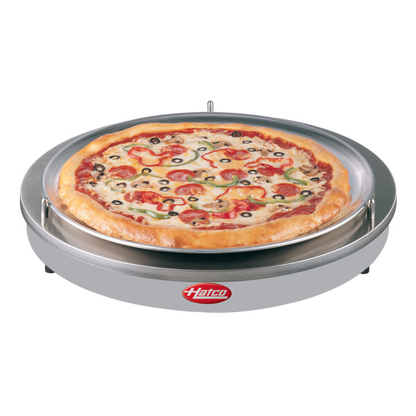 A pizza on a Hatco heated shelf.