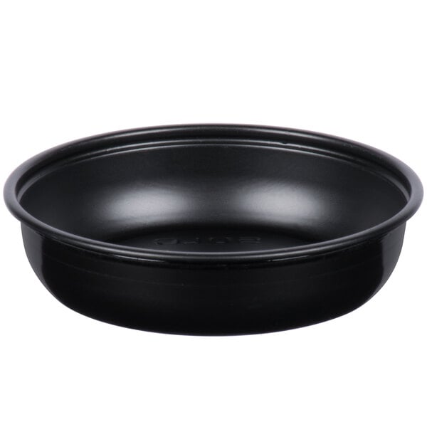 A black Solo wide sauce portion cup with a white background.