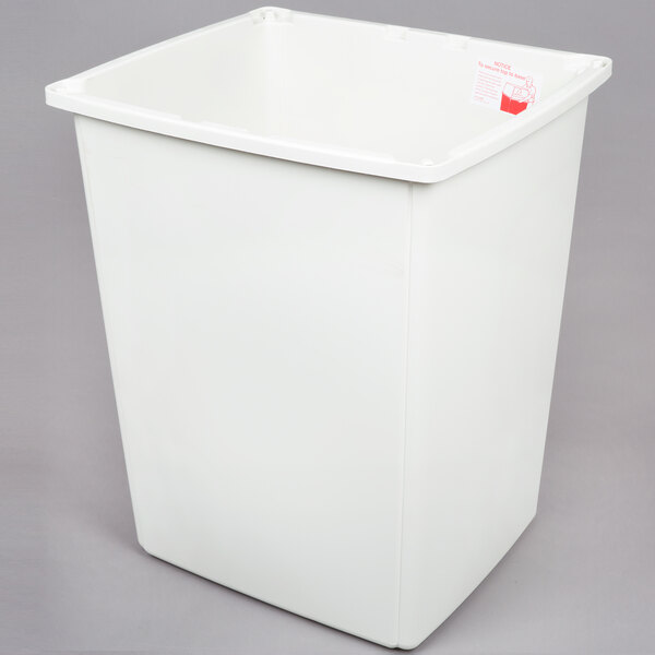A white Rubbermaid Glutton outdoor trash container with a lid and red label.