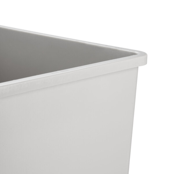 A close-up of a white square rigid plastic container.