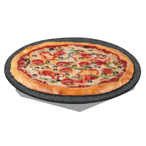 A pizza on a Hatco heated stone shelf with pepperoni and olives.