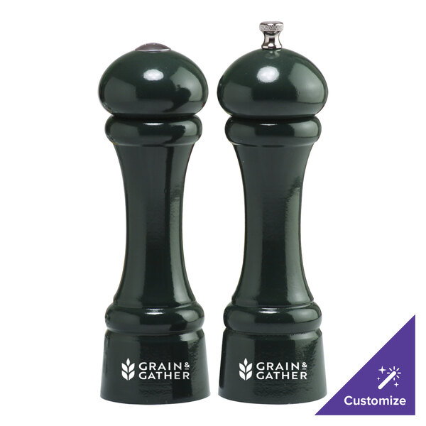 Two Chef Specialties pepper mills with forest green handles.