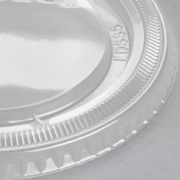 A clear plastic Solo Snaptight lid with a plastic rim.