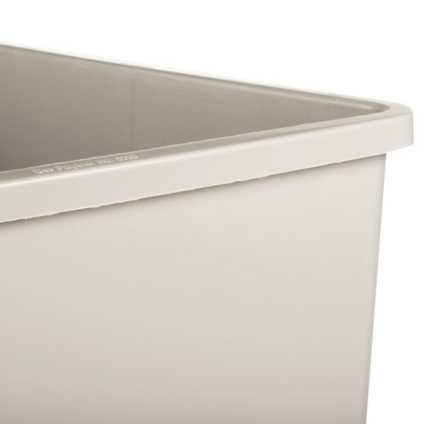 A close-up of a beige square rigid plastic tub.