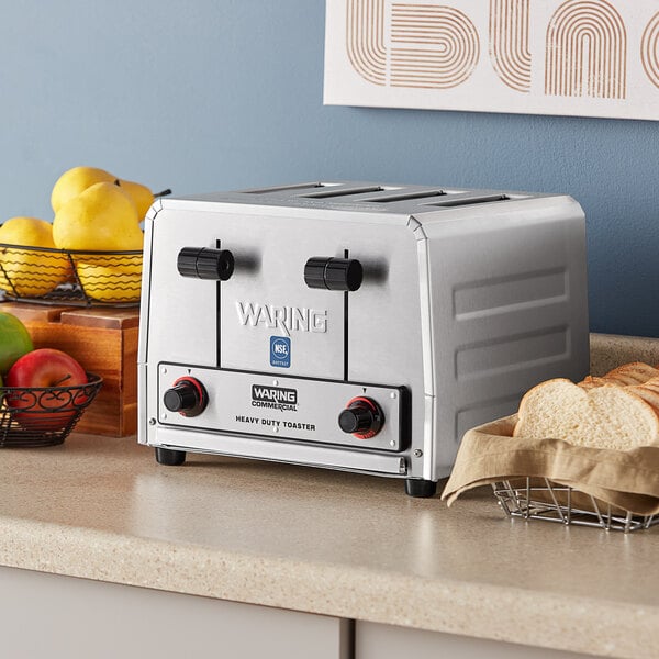 A silver Waring commercial toaster on a counter.