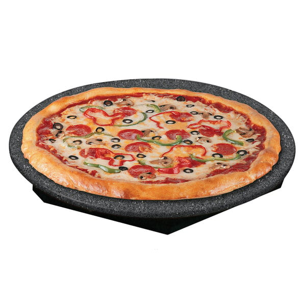 A pizza on a Hatco heated stone shelf with a black base.