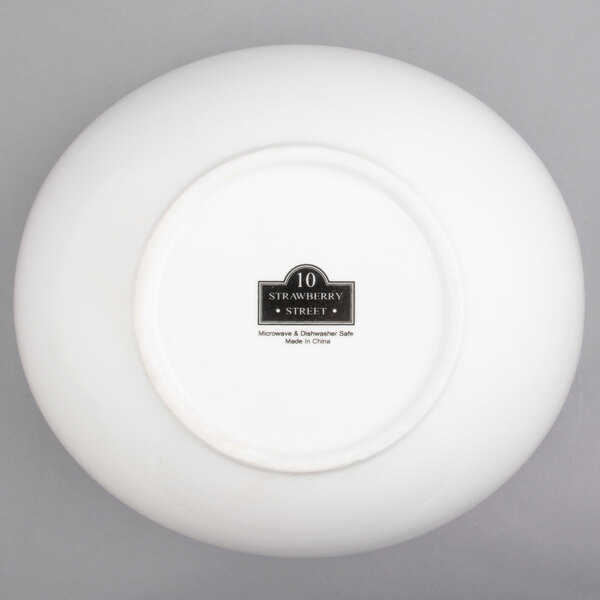 A white porcelain bowl with cut outs.