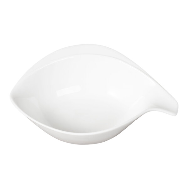 A white porcelain bowl with a handle, shaped with a unique tail-like design.