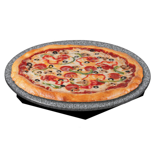 A pizza on a Hatco granite heated stone shelf with pepperoni and olives.