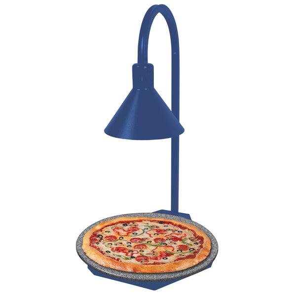 A pizza on a Hatco heated stone shelf with a display lamp.