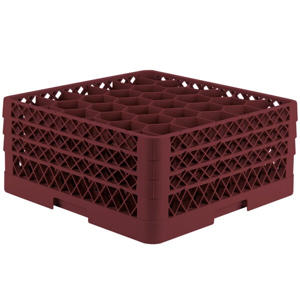 A red Vollrath Traex glass rack with small compartments.