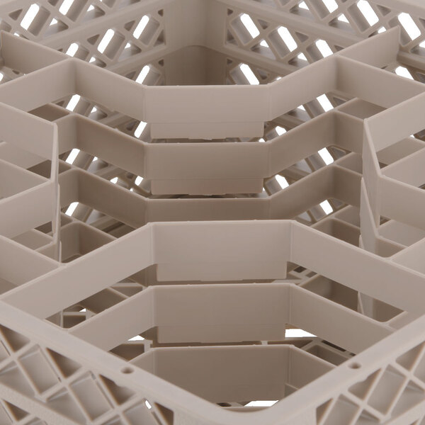 A beige plastic Vollrath Traex glass rack with 30 compartments.