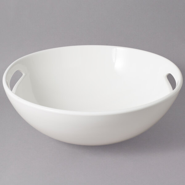 A white 10 Strawberry Street Whittier handled bowl.
