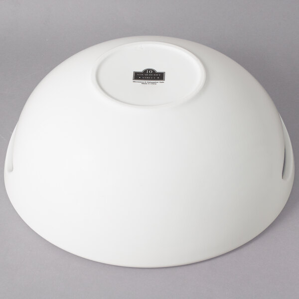 A white 10 Strawberry Street Whittier round porcelain handled bowl with a logo on it.
